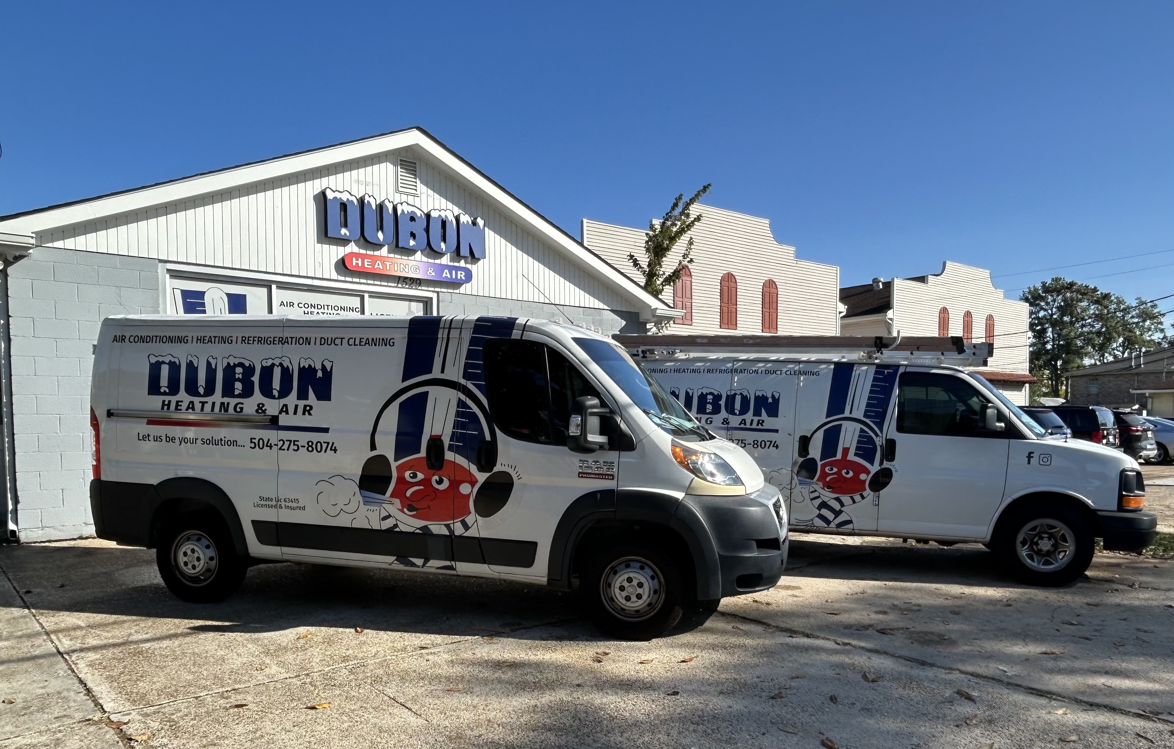Dubon Heating and Air service vans at the Metairie shop